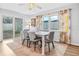 Bright dining room with sliding glass doors to backyard at 6321 Staunton Dr, Holiday, FL 34690