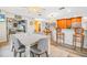 Spacious dining room with barstool seating and easy access to the kitchen and living spaces at 6321 Staunton Dr, Holiday, FL 34690