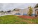 Home exterior showcasing a side yard with landscaping and fence at 6321 Staunton Dr, Holiday, FL 34690