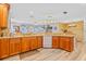 Updated kitchen with granite countertops, wood cabinets, and island at 6321 Staunton Dr, Holiday, FL 34690