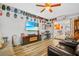 Cozy living room with fireplace, sports memorabilia, and an open floor plan at 6321 Staunton Dr, Holiday, FL 34690
