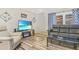 Comfortable living room with entertainment center, modern decor, and plenty of seating at 6321 Staunton Dr, Holiday, FL 34690