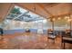 Relaxing screened porch with stamped concrete floor and patio furniture at 6321 Staunton Dr, Holiday, FL 34690