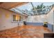 Spacious screened porch with stamped concrete flooring and string lights at 6321 Staunton Dr, Holiday, FL 34690