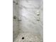 Clean shower with marble tile and built-in shelves at 6321 Staunton Dr, Holiday, FL 34690