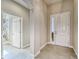 Welcoming entryway with tiled floor & white front door at 6445 Tideline Dr, Apollo Beach, FL 33572