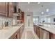 Open concept kitchen with view to the living room, gas stove, and quartz countertops at 6445 Tideline Dr, Apollo Beach, FL 33572