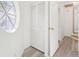 Bright hallway with built-in storage and circular window at 6833 S Wall St, Tampa, FL 33616