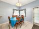 Cozy breakfast nook with a round table and chairs, adjacent to kitchen at 7115 W Creek Dr, Tampa, FL 33615