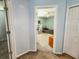 View down hallway with access to bedrooms at 7115 W Creek Dr, Tampa, FL 33615