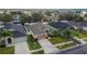 Aerial view showcasing a single-Gathering house with a backyard and neighborhood at 7142 Royal George Ct, Wesley Chapel, FL 33545