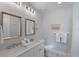 Bathroom with double vanity and modern fixtures at 752 N Shore Dr, Anna Maria, FL 34216