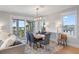 Open concept dining area with ocean views and modern chandelier at 752 N Shore Dr, Anna Maria, FL 34216