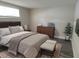 Guest bedroom with wood-look floors and modern dresser at 7624 Karen Dr, Port Richey, FL 34668