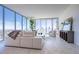 Bright living room featuring floor-to-ceiling windows, modern furniture, and stylish decor at 777 3Rd N Ave # 1503, St Petersburg, FL 33701