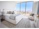 Main bedroom features a plush bed and breathtaking city views at 777 3Rd N Ave # 1605, St Petersburg, FL 33701