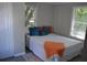 Bright bedroom with double bed and two windows at 8010 N 11Th St, Tampa, FL 33604