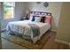 Cozy bedroom with a queen-size bed and a neutral color scheme at 8010 N 11Th St, Tampa, FL 33604
