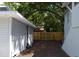 Side yard of the house showing a wooden fence at 8010 N 11Th St, Tampa, FL 33604