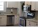 Modern kitchen with granite countertops and stainless steel appliances at 8010 N 11Th St, Tampa, FL 33604