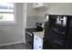 Kitchen with granite countertops, stainless steel appliances, and white cabinets at 8010 N 11Th St, Tampa, FL 33604