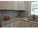 Renovated kitchen with granite countertops and stainless steel appliances at 8010 N 11Th St, Tampa, FL 33604