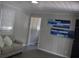 Living room with gray walls and wood-look floors at 8010 N 11Th St, Tampa, FL 33604