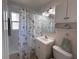 Clean and functional bathroom with a shower-tub combination, white vanity, and coastal-themed accents at 8153 22Nd N Ave, St Petersburg, FL 33710