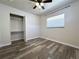 Bright bedroom with wood floors, a ceiling fan, a closet and a window with natural light at 8153 22Nd N Ave, St Petersburg, FL 33710