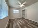 Inviting bedroom with hardwood floors, a window, a ceiling fan, and a spacious closet at 8153 22Nd N Ave, St Petersburg, FL 33710
