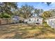 Spacious backyard with grassy area and wooden fence at 1558 13Th S St, St Petersburg, FL 33705