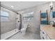 Clean bathroom features a walk-in shower and grey tile at 1558 13Th S St, St Petersburg, FL 33705