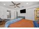 Relaxing bedroom with hardwood floors, ceiling fan, and built-in storage at 1558 13Th S St, St Petersburg, FL 33705