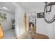 Bright hallway with wood floors, leading to living areas and laundry at 1558 13Th S St, St Petersburg, FL 33705