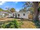 Charming single story home with white exterior and walkway at 1558 13Th S St, St Petersburg, FL 33705