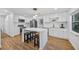 Modern kitchen with white cabinets, stainless steel appliances, and an island at 1558 13Th S St, St Petersburg, FL 33705