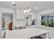 Modern kitchen with white cabinets, quartz countertops, and stainless steel appliances at 1558 13Th S St, St Petersburg, FL 33705