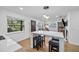 Open concept kitchen and living area with island and hardwood floors at 1558 13Th S St, St Petersburg, FL 33705
