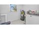 Laundry room with washer, dryer, and updated flooring at 1558 13Th S St, St Petersburg, FL 33705