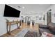 Open concept living room with leather couch and kitchen view at 1558 13Th S St, St Petersburg, FL 33705