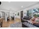 Living room with leather sofa, ottoman, and open kitchen view at 1558 13Th S St, St Petersburg, FL 33705