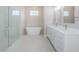 Modern bathroom with dual vanity, soaking tub, glass shower at 16117 Medrick Rd, Brooksville, FL 34614