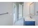 Modern bathroom with blue vanity and marble countertop at 16117 Medrick Rd, Brooksville, FL 34614