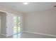 A bedroom with sliding glass doors and tile floors at 16117 Medrick Rd, Brooksville, FL 34614
