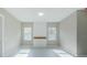 Spacious bedroom with wood accent wall and large windows at 16117 Medrick Rd, Brooksville, FL 34614