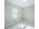 Unfurnished bedroom with tile flooring and natural light at 16117 Medrick Rd, Brooksville, FL 34614
