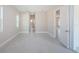 Bedroom with tile floors and access to another room at 16117 Medrick Rd, Brooksville, FL 34614