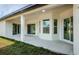 Exterior view of a covered patio with sliding glass doors at 16117 Medrick Rd, Brooksville, FL 34614