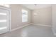 Bright dining room with modern chandelier and tile floors at 16117 Medrick Rd, Brooksville, FL 34614