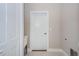 Laundry room with a utility sink and white door at 16117 Medrick Rd, Brooksville, FL 34614